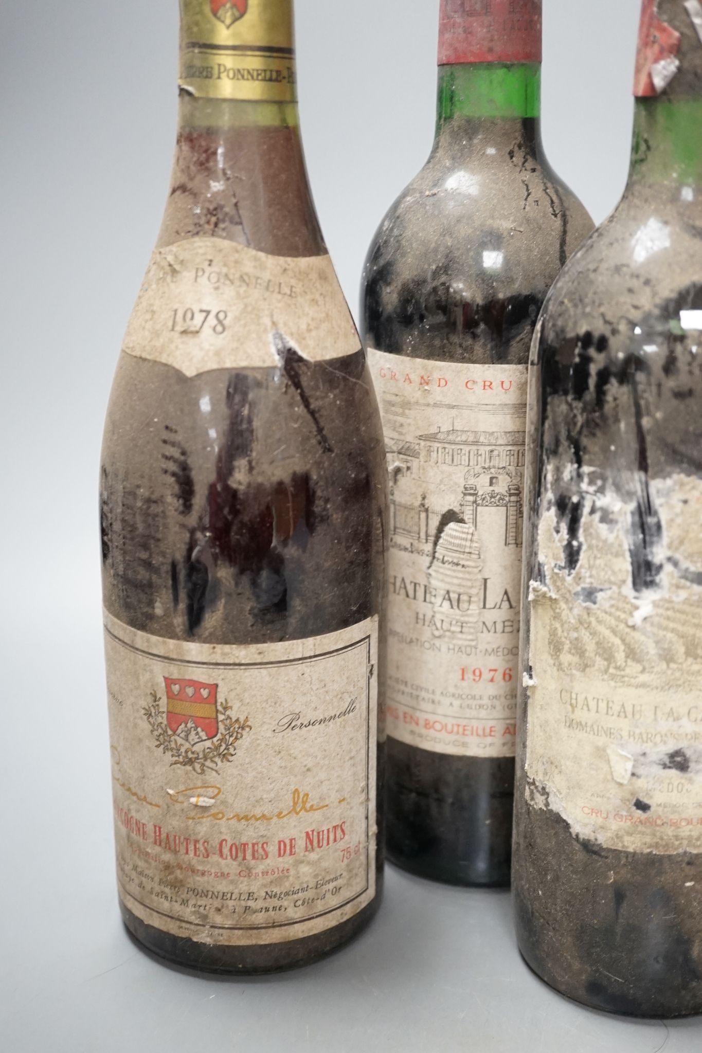 Six various bottles of red wine including two bottles of Château La Lagune 1976 etc.